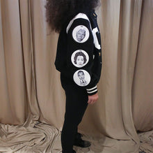 Load image into Gallery viewer, Black and white varsity jacket with chenille letter patch and patches with drawings on them women