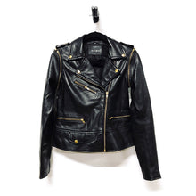 Load image into Gallery viewer, Women's black leather jacket with gold zippers and zip off sleeves