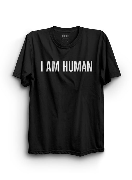 Black shirt with white text that says I AM HUMAN on the front