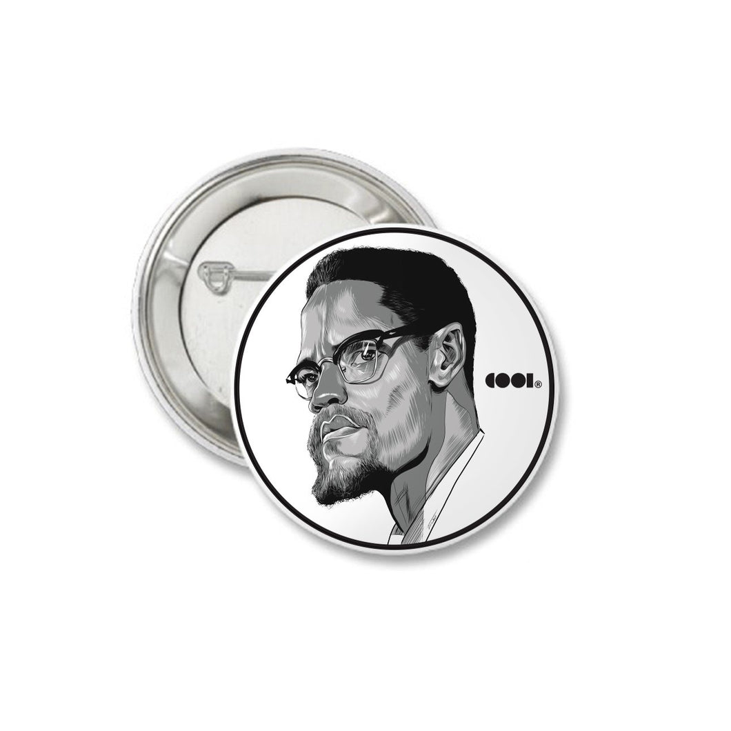 White and black matte pin back button with Malcolm X drawing on it
