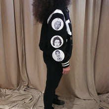 Load image into Gallery viewer, Black and white varsity jacket with chenille letter patch and patches with drawings on them women

