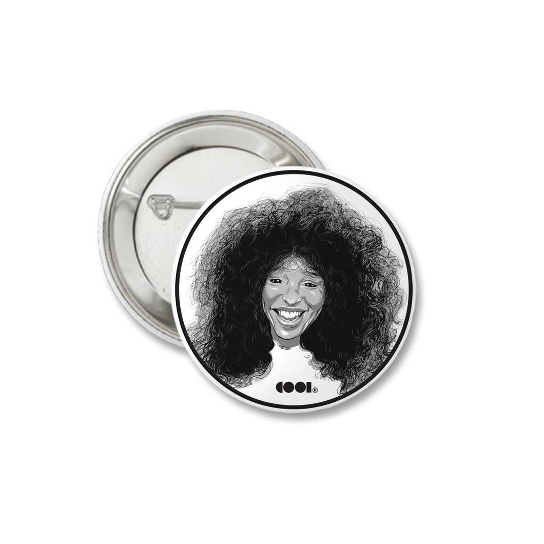White and black matte pin back button with Chaka Khan drawing on it