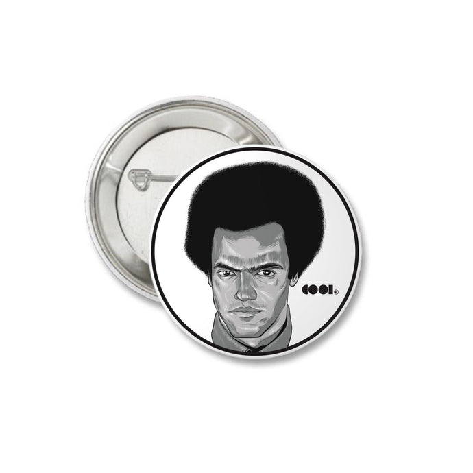 White and black matte pin back button with Huey P. Newton drawing on it