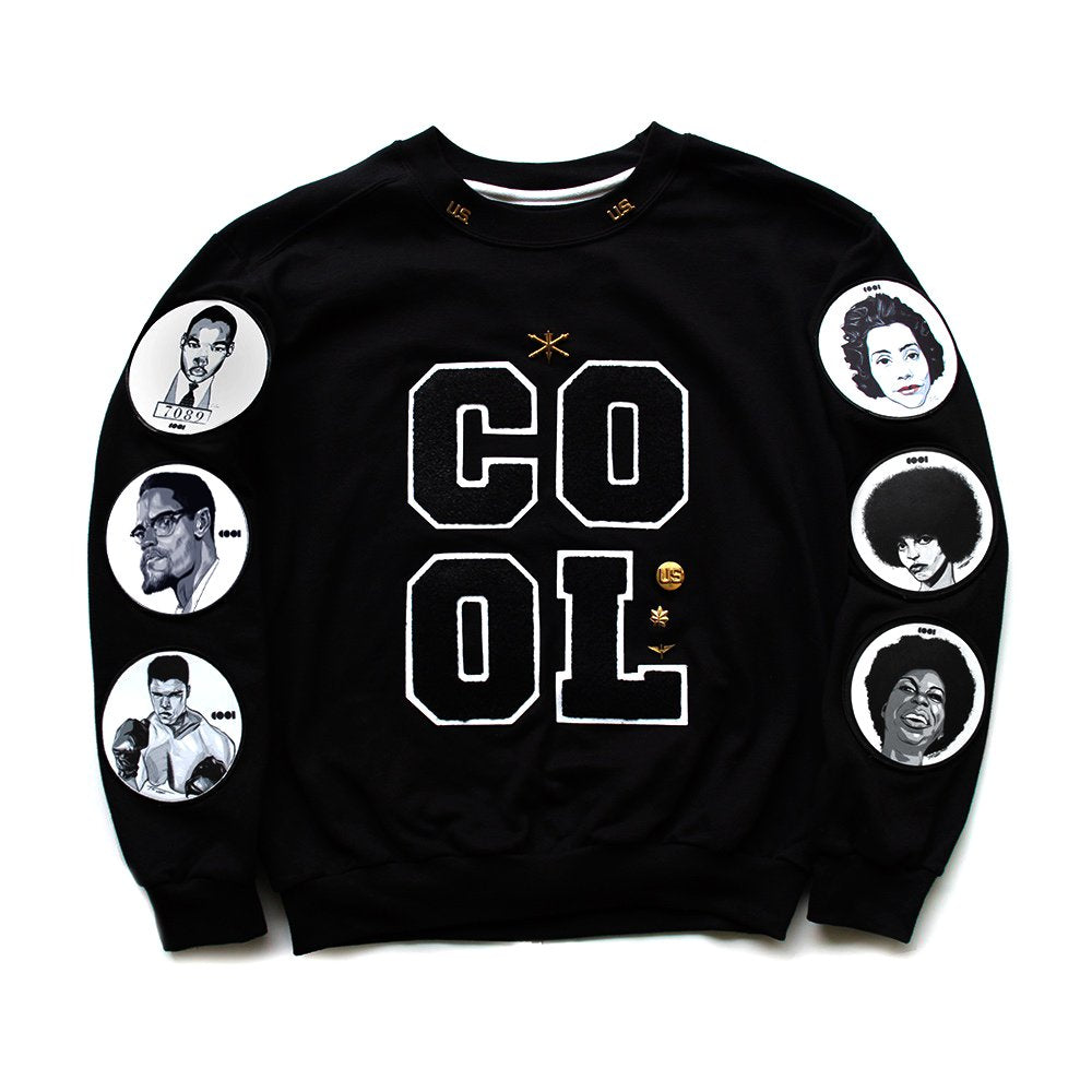 Black crewneck sweatshirt with chenille letter patches on the front and patches with black icons on the sleeves