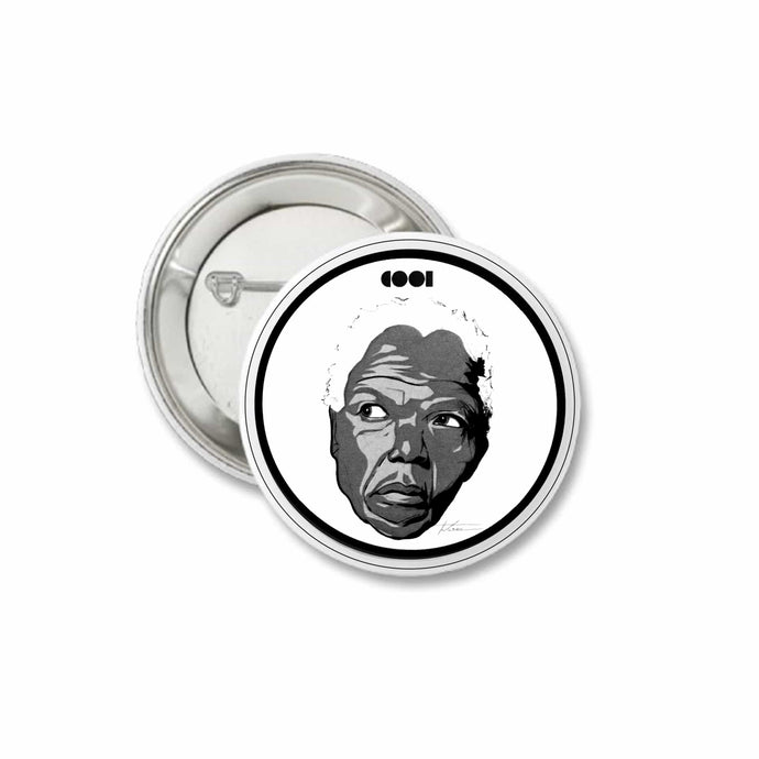 White and black matte pin back button with Nelson Mandela drawing on it
